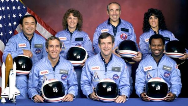 Challenger astronauts  (back row) Ellison S. Onizuka, Sharon Christa McAuliffe, Greg Jarvis, and Judy Resnik; (front row) Mike Smith, Dick Scobee, and Ron McNair. Photo courtesy of NASA.